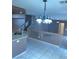 Dining room featuring tile floors, modern lights, and access to the stairs at 1511 Balsam Mist Ave, Las Vegas, NV 89183