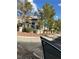 View of the two-story home with tile roof seen from street, highlighting well-maintained landscaping and corner lot at 1511 Balsam Mist Ave, Las Vegas, NV 89183