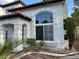 Beautiful home with a tile roof, stucco exterior, and lush desert landscaping at 1511 Balsam Mist Ave, Las Vegas, NV 89183
