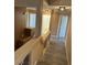 Bright hallway featuring fresh paint, modern lighting, and durable laminate wood flooring at 1511 Balsam Mist Ave, Las Vegas, NV 89183