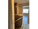 Hallway view of a well-maintained interior with neutral tones, built-in shelving and new flooring at 1511 Balsam Mist Ave, Las Vegas, NV 89183
