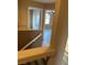 Hallway with doorways leading to rooms with neutral interiors and hardwood flooring at 1511 Balsam Mist Ave, Las Vegas, NV 89183