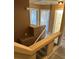 Hallway and staircase with updated fixtures and new flooring providing a neat and inviting access to upper floors at 1511 Balsam Mist Ave, Las Vegas, NV 89183