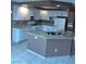 Spacious kitchen featuring white cabinets and granite countertops at 1511 Balsam Mist Ave, Las Vegas, NV 89183