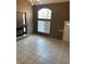 Spacious living room with tile flooring, fireplace, high ceilings, and ample natural light at 1511 Balsam Mist Ave, Las Vegas, NV 89183