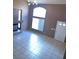 Bright and spacious living room with tiled floors, fireplace, and large windows at 1511 Balsam Mist Ave, Las Vegas, NV 89183