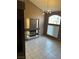 Bright living room with tiled floors, cozy fireplace and high ceilings perfect for relaxing or entertaining guests at 1511 Balsam Mist Ave, Las Vegas, NV 89183