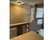 View of staircase overlooking kitchen with modern appliances and granite counters at 1511 Balsam Mist Ave, Las Vegas, NV 89183