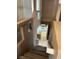 Staircase that overlooks kitchen and offers natural light from a window above stove at 1511 Balsam Mist Ave, Las Vegas, NV 89183