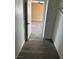 Walk-in closet view looking to a bedroom with modern flooring at 1511 Balsam Mist Ave, Las Vegas, NV 89183