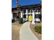 Inviting entrance featuring bright yellow double doors and manicured landscaping at 1871 Ski Slope Cir, Las Vegas, NV 89117