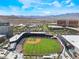Bird's eye view reveals the baseball park featuring seating, lights, and a well-manicured green field at 2152 Jasper Bluff St # 103, Las Vegas, NV 89117