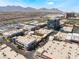This overhead image features commercial buildings, local roads, parking, and a stunning mountain view at 2152 Jasper Bluff St # 103, Las Vegas, NV 89117