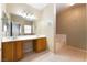 Bathroom boasts a double sink vanity, large mirror, tile flooring, and a soaking tub at 2152 Jasper Bluff St # 103, Las Vegas, NV 89117