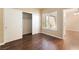 Bedroom features a spacious closet and shuttered window overlooking the neighborhood at 2152 Jasper Bluff St # 103, Las Vegas, NV 89117