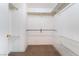 Walk in closet featuring built in wire shelving, carpet, and a hanging rack at 2152 Jasper Bluff St # 103, Las Vegas, NV 89117