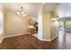 Open-concept dining area with hardwood floors and access to the kitchen and living room at 2152 Jasper Bluff St # 103, Las Vegas, NV 89117