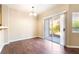 Bright dining room features wood floors and a sliding glass door to the patio at 2152 Jasper Bluff St # 103, Las Vegas, NV 89117