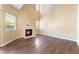 Living room features wood floors, natural light, and a cozy fireplace at 2152 Jasper Bluff St # 103, Las Vegas, NV 89117