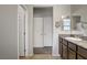 Bathroom featuring a granite countertop vanity and door leading to a walk-in closet at 2169 Rio Rancho Pointe Pl, Henderson, NV 89002
