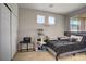 Bedroom with a queen bed, decorative wall art, a cat tree, and sliding closet doors at 2169 Rio Rancho Pointe Pl, Henderson, NV 89002