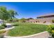Lush green space in the community with mature trees and manicured landscaping at 2169 Rio Rancho Pointe Pl, Henderson, NV 89002