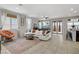 Bright living room with tile flooring, large windows, stylish furnishings, and access to dining area at 2169 Rio Rancho Pointe Pl, Henderson, NV 89002