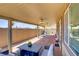 Covered patio with outdoor seating area, ceiling fans, and mountain views at 2169 Rio Rancho Pointe Pl, Henderson, NV 89002