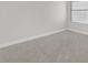Bedroom with neutral carpet, white walls, and a window at 2402 El Cid Ct, Henderson, NV 89014