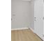 Functional laundry area with white walls, baseboard, and a white door at 2402 El Cid Ct, Henderson, NV 89014