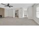 Spacious living room featuring neutral walls, fireplace, and hallway access at 2402 El Cid Ct, Henderson, NV 89014