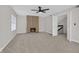Living room boasts a fireplace and access to upper level staircase at 2402 El Cid Ct, Henderson, NV 89014