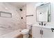 Updated bathroom with a modern walk-in shower, white vanity, and black accents at 2481 San Marcos St, Las Vegas, NV 89115