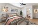 Bright bedroom with natural light and minimalist design, featuring a ceiling fan at 2481 San Marcos St, Las Vegas, NV 89115