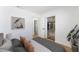 Bright bedroom with closet storage, plants and a view into the ensuite bathroom at 2481 San Marcos St, Las Vegas, NV 89115
