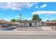 Charming single-story home featuring a fenced yard, car port, and mature trees at 2481 San Marcos St, Las Vegas, NV 89115