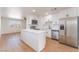 Modern kitchen featuring white cabinets, stainless steel appliances, and a center island at 2481 San Marcos St, Las Vegas, NV 89115