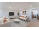 Inviting living room featuring hardwood floors, neutral paint, and plenty of natural light at 2481 San Marcos St, Las Vegas, NV 89115