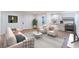 Bright living room with stylish decor, modern furnishings, and an open layout to the kitchen at 2481 San Marcos St, Las Vegas, NV 89115