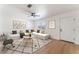 Bright living room showcasing modern decor, hardwood floors, and a ceiling fan at 2481 San Marcos St, Las Vegas, NV 89115