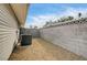 Low-maintenance backyard with gravel area, perfect for storage or landscaping at 2496 Golfers St, Las Vegas, NV 89142