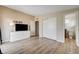 Bedroom featuring wood-look floors and adjacent bathroom at 2496 Golfers St, Las Vegas, NV 89142