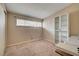 Bedroom featuring neutral carpet, a sunny window and closet at 2496 Golfers St, Las Vegas, NV 89142