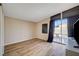 Bedroom with wood flooring, sliding glass door to the pool at 2496 Golfers St, Las Vegas, NV 89142