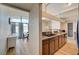 Modern kitchen with granite counters flowing into the dining room at 2496 Golfers St, Las Vegas, NV 89142