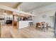 Bright and open-concept with dining table, kitchen and fireplace at 2496 Golfers St, Las Vegas, NV 89142