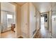 Hallway leading to bathroom, rooms, and door to outside area in a well lit space at 2496 Golfers St, Las Vegas, NV 89142