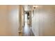 Hallway with wood floors leading to the living room with sliding glass doors at 2496 Golfers St, Las Vegas, NV 89142