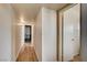 Hallway with wood floors and view of bedroom and bathroom at 2496 Golfers St, Las Vegas, NV 89142
