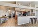 Modern kitchen with granite countertops, dark wood cabinets and stainless steel appliances at 2496 Golfers St, Las Vegas, NV 89142